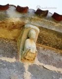 Fuente Urbel. Santa Maria. Canecillo con personaje sedente con libro