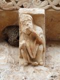 Olmo, El. Virgen del Olmo. Canecillo figurado