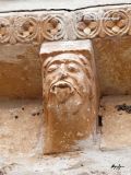 Olmo, El. Virgen del Olmo. Canecillo con rostro humano con gesto burln