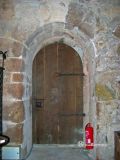 Coustouges. Santa Mara. Puerta interior de medio punto ligeramente apuntado