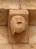 Cerezo de Arriba. San Juan Bautista. Canecillo con rostro humano