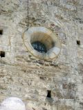 Llo. Sant Fructuós. Fachada oeste: óculo inscrito en un arco de medio punto ciego
